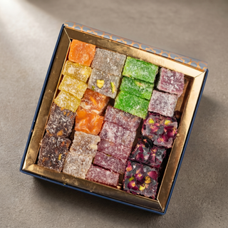 Assorted Turkish delight gift box on a stone surface