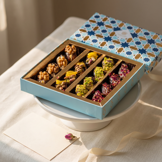 Assorted stuffed dates styled as a gift with note card and ribbon