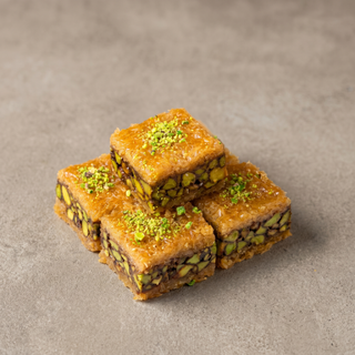 Pistachio kunafa on a stone surface, premium gift sweet