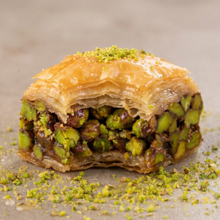 Pistachio square baklava cut to show the layered phyllo and pistachio, macro