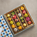 Assorted Indian Fusion Sweets on a stone surface, premium gift
