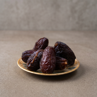 Premium Kalmi Dates on a stone surface, premium gift