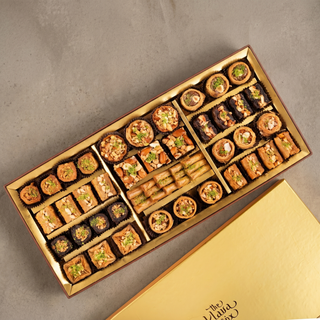 Sunheri Assorted Baklava and Stuffed Dates Hamper open gift box revealing the contents