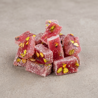 Pomegranate and Pistachio Turkish Delight on a stone surface, premium gift